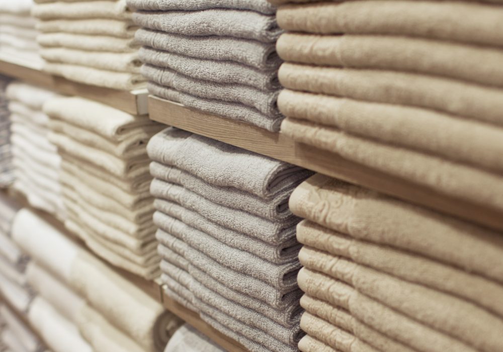 folded cream colored towels stacked